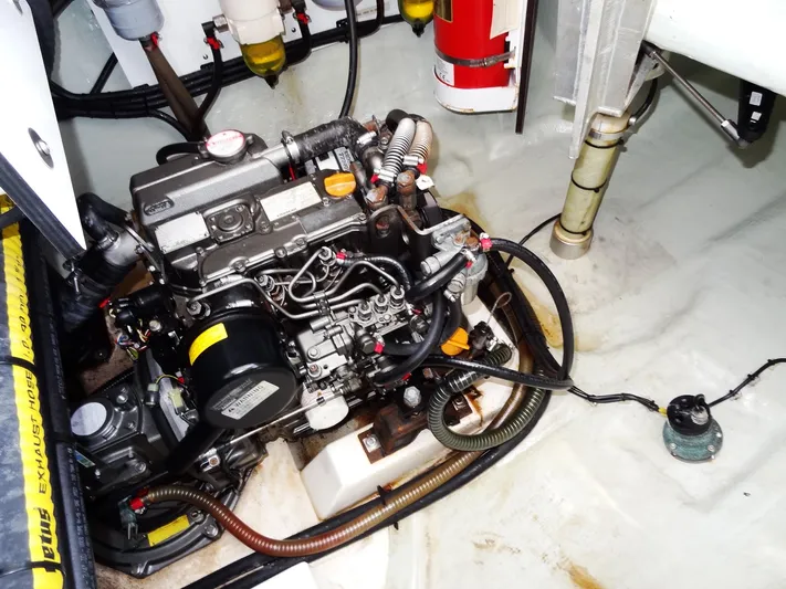 Blue Tiger Yacht Photos Pics Engine compartment of a 2021 Leopard 40 catamaran, showcasing mechanical components and wiring.