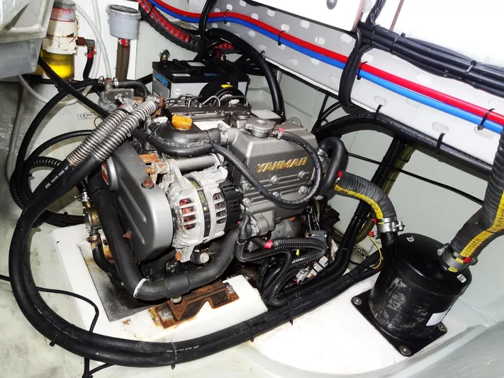 Blue Tiger Yacht Photos Pics Engine compartment of a 2021 Leopard 40, featuring a Yanmar engine with visible wiring and components.
