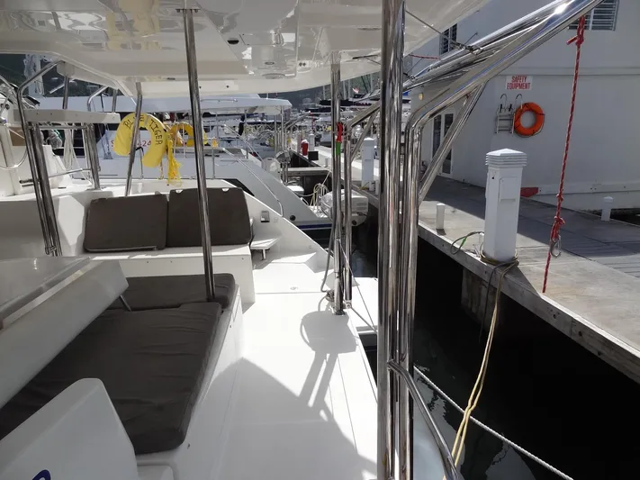 Blue Tiger Yacht Photos Pics Leopard 40 catamaran docked, featuring outdoor seating and polished metal railings, 2021 model.