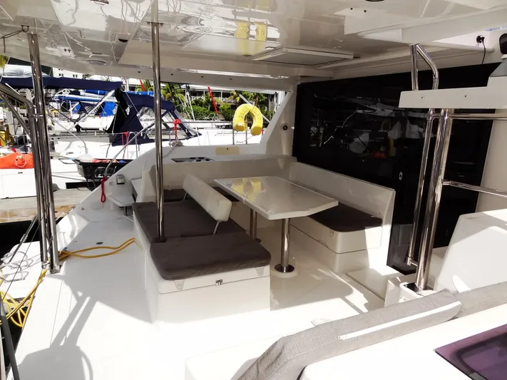 Blue Tiger Yacht Photos Pics Leopard 40 catamaran cockpit with seating and table, docked at marina, 2021 model.