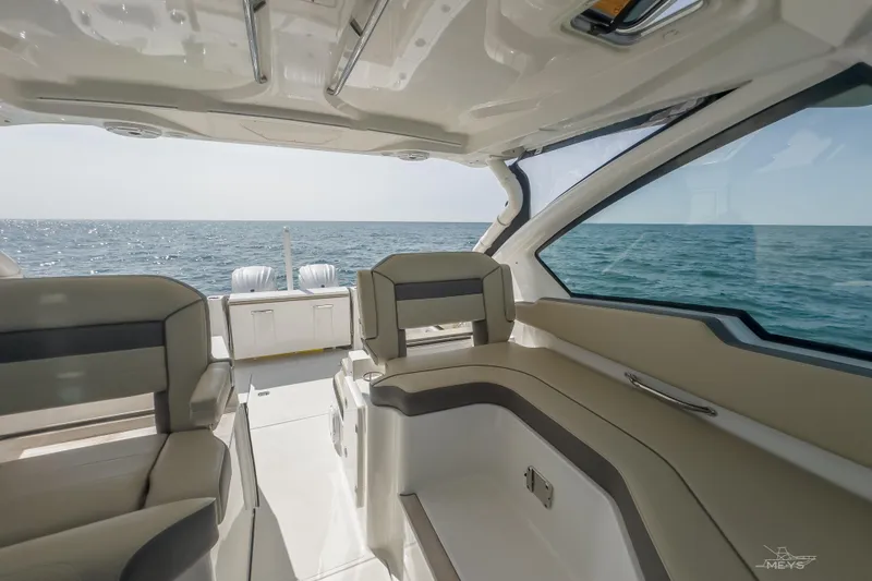 Pathfinder Yacht Photos Pics Interior view of 2021 Pursuit DC 326 Dual Console boat on open sea.