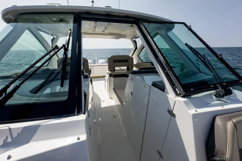 Pathfinder Yacht Photos Pics 2021 Pursuit DC 326 Dual Console boat interior with ocean view.