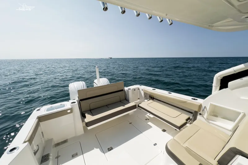 Pathfinder Yacht Photos Pics 2021 Pursuit DC 326 Dual Console boat on open sea, spacious deck view.