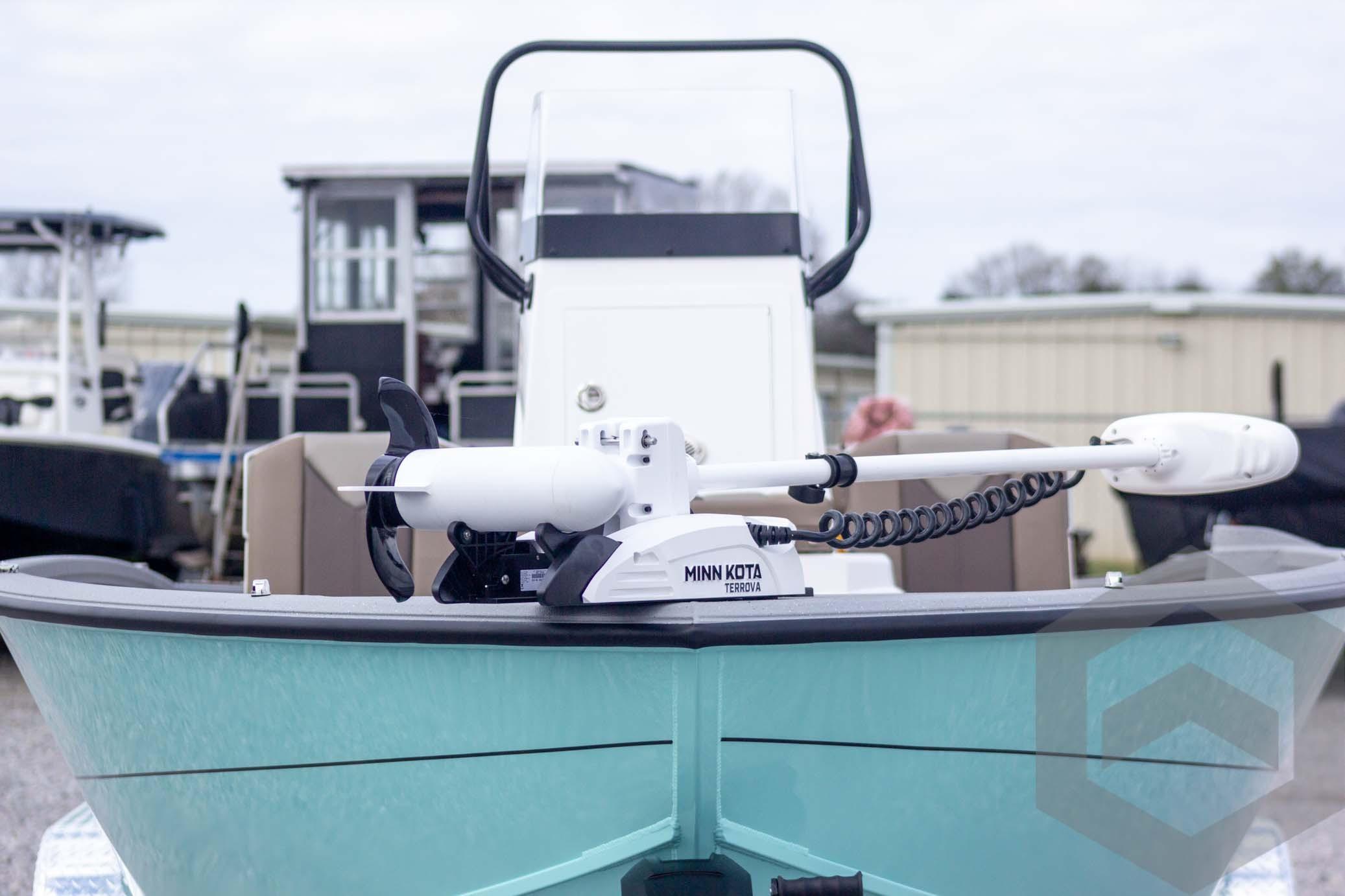 2026 Vexus ACX 2150 boat with Minn Kota Terrova trolling motor, docked outdoors.