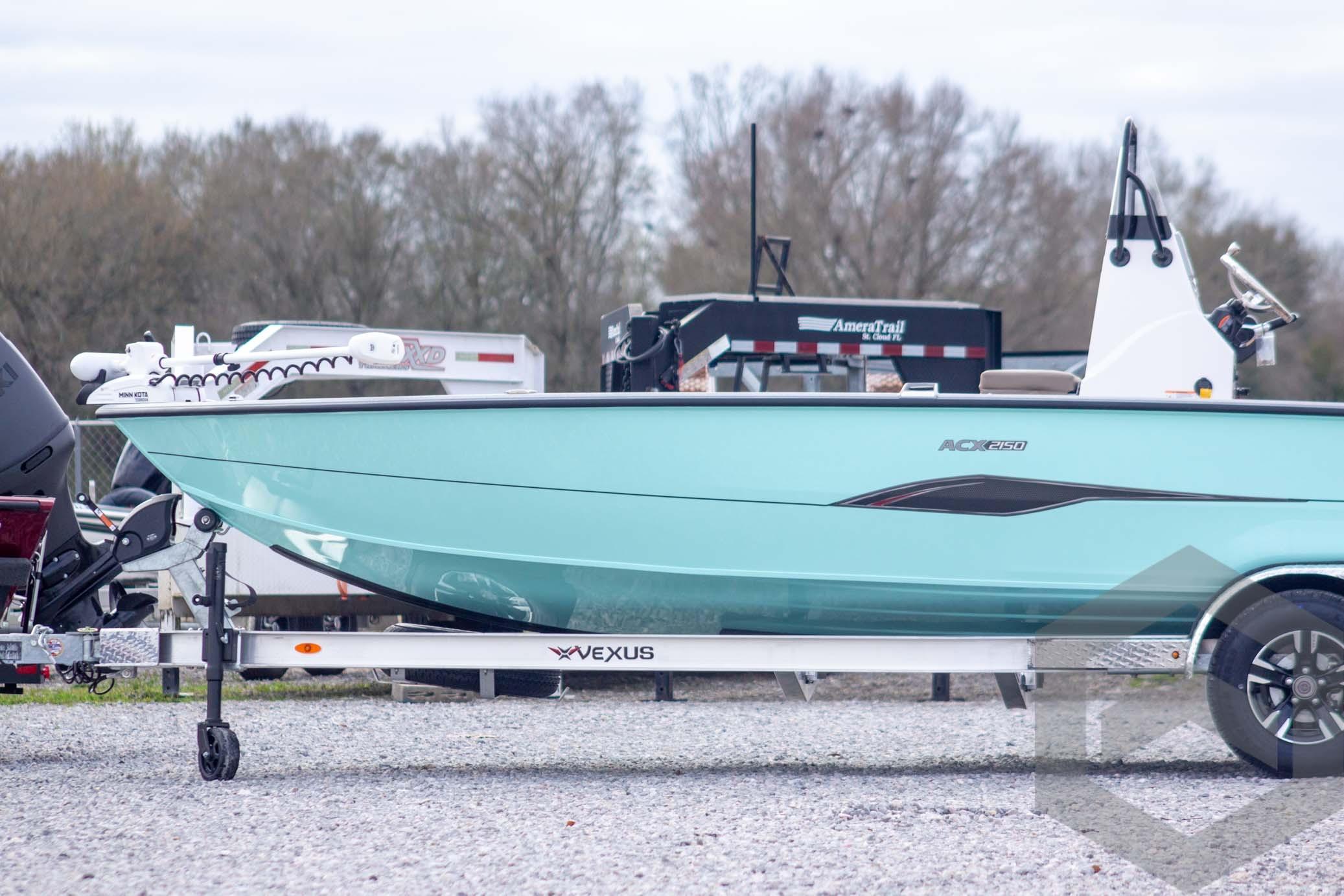 2026 Vexus ACX 2150 boat on trailer, displayed outdoors with trees in background.