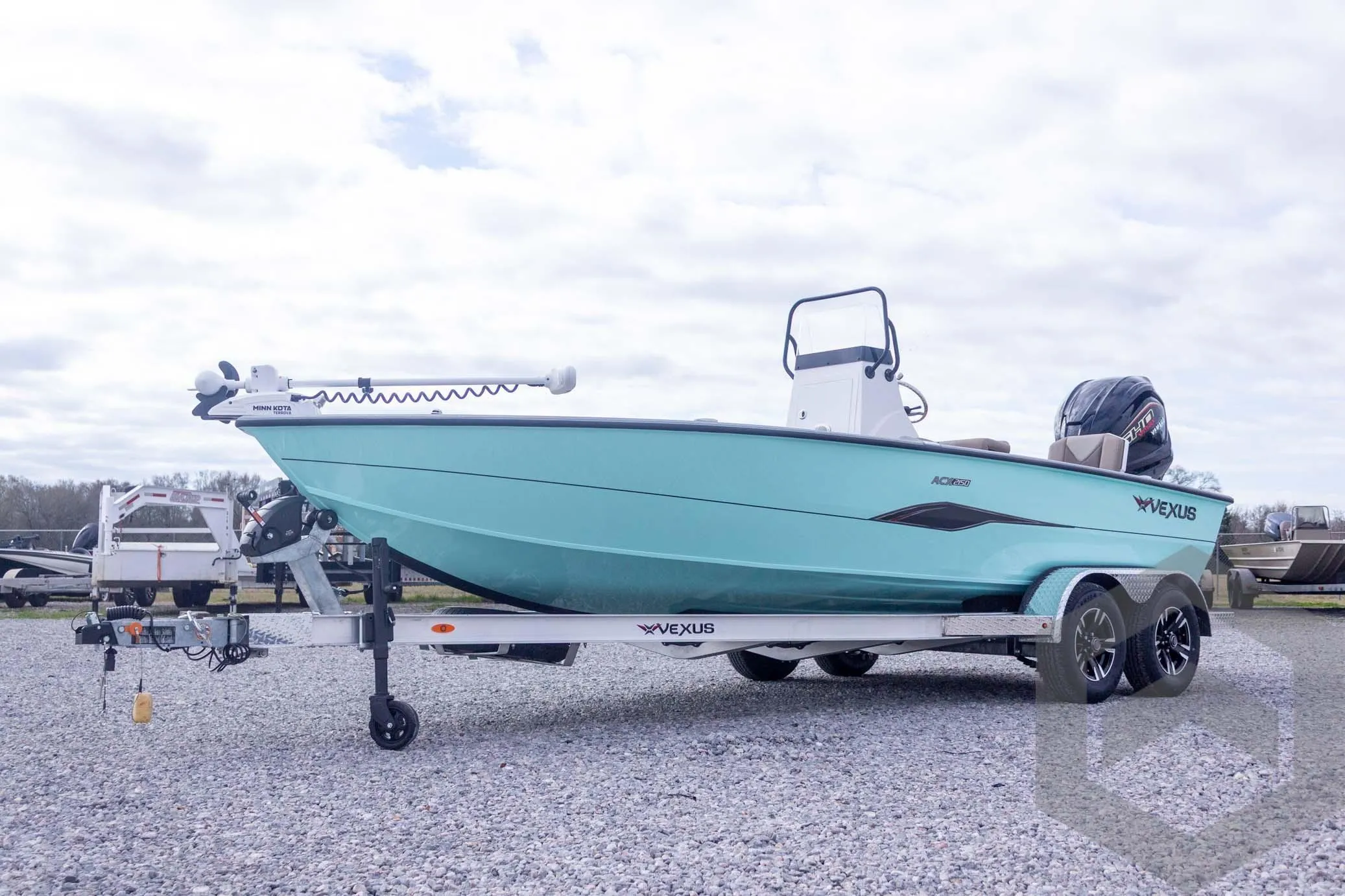 2026 Vexus ACX 2150 boat on trailer, turquoise hull, parked on gravel.