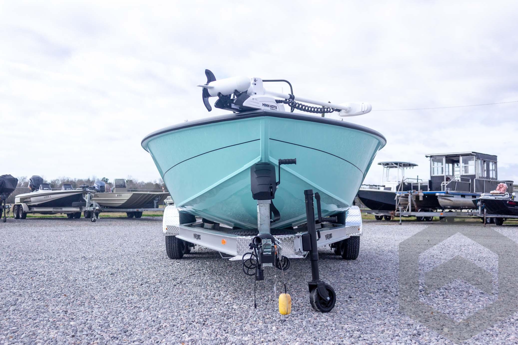 2026 Vexus ACX 2150 boat on trailer, displayed outdoors with other boats.