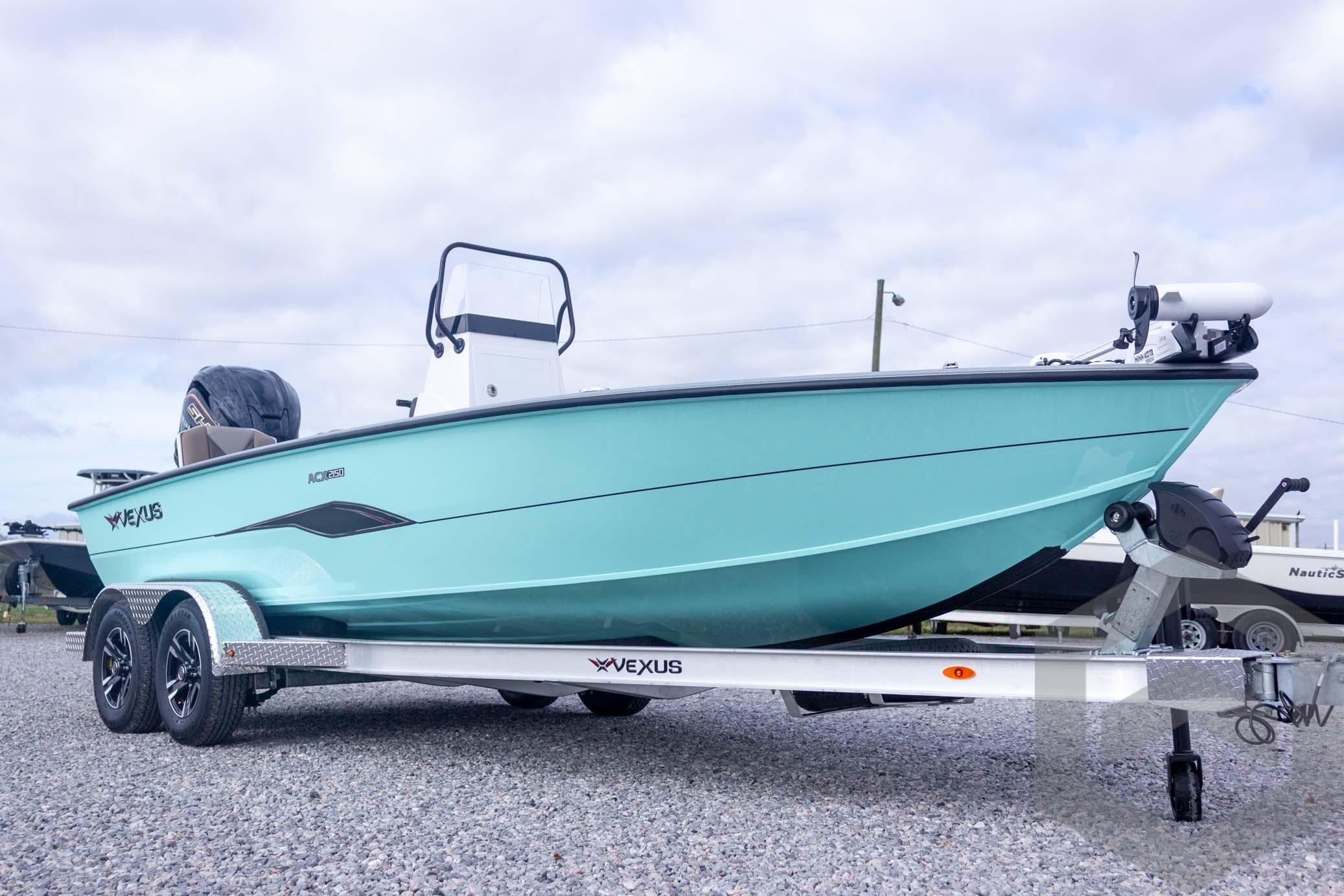 2026 Vexus ACX 2150 boat on trailer, light blue hull, parked on gravel.