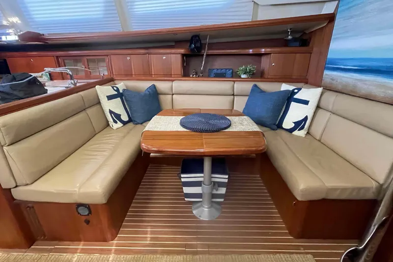 La Veda Yacht Photos Pics Interior of 2003 Hunter 426 Deck Salon with cozy seating and nautical decor.