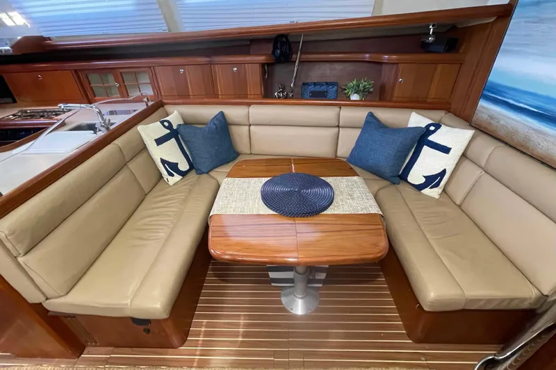 La Veda Yacht Photos Pics Luxurious interior of 2003 Hunter 426 Deck Salon with cozy seating and nautical decor.