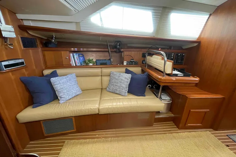 La Veda Yacht Photos Pics Interior of 2003 Hunter 426 Deck Salon with beige seating and navigation station.