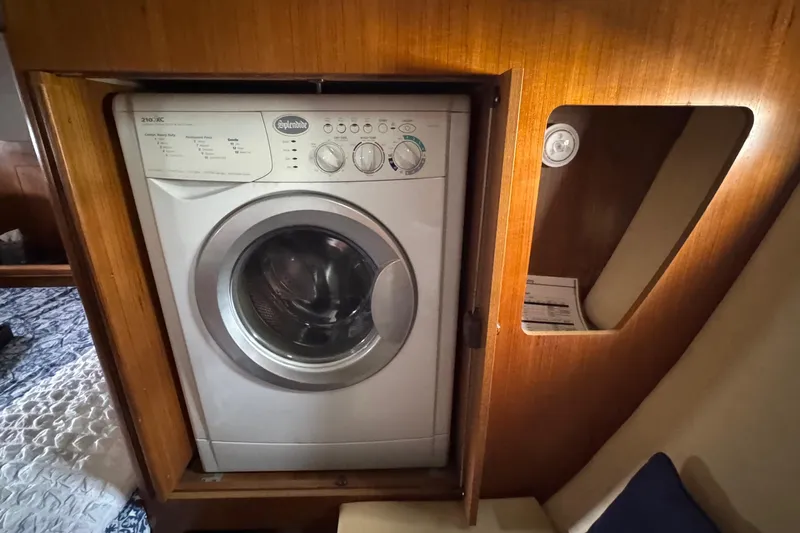La Veda Yacht Photos Pics Built-in washing machine in 2003 Hunter 426 Deck Salon yacht interior.
