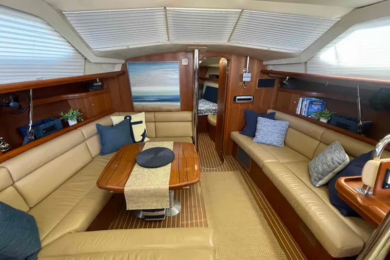 La Veda Yacht Photos Pics Luxurious interior of 2003 Hunter 426 Deck Salon with plush seating and elegant decor.
