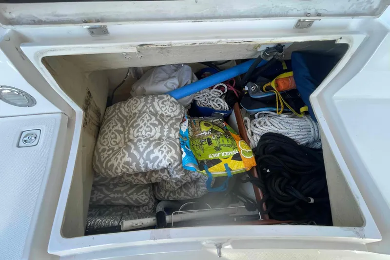 La Veda Yacht Photos Pics Storage compartment of 2003 Hunter 426 Deck Salon with ropes, cushions, and gear.