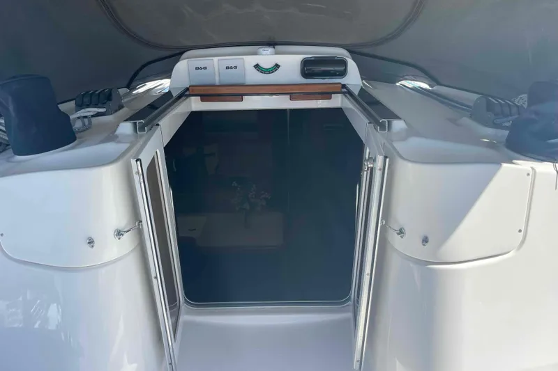 La Veda Yacht Photos Pics Entrance to 2003 Hunter 426 Deck Salon yacht, featuring open doors and navigation equipment.