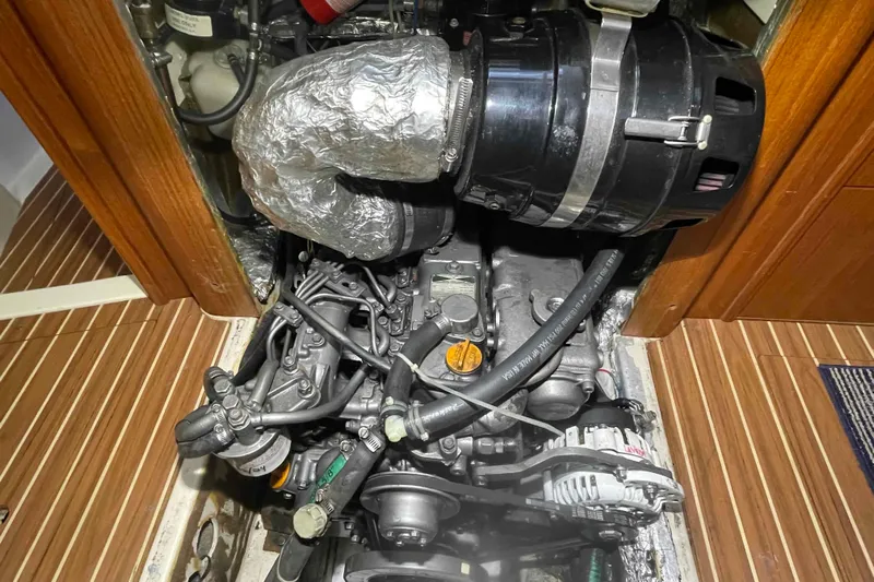 La Veda Yacht Photos Pics Engine compartment of 2003 Hunter 426 Deck Salon sailboat, showcasing mechanical components.