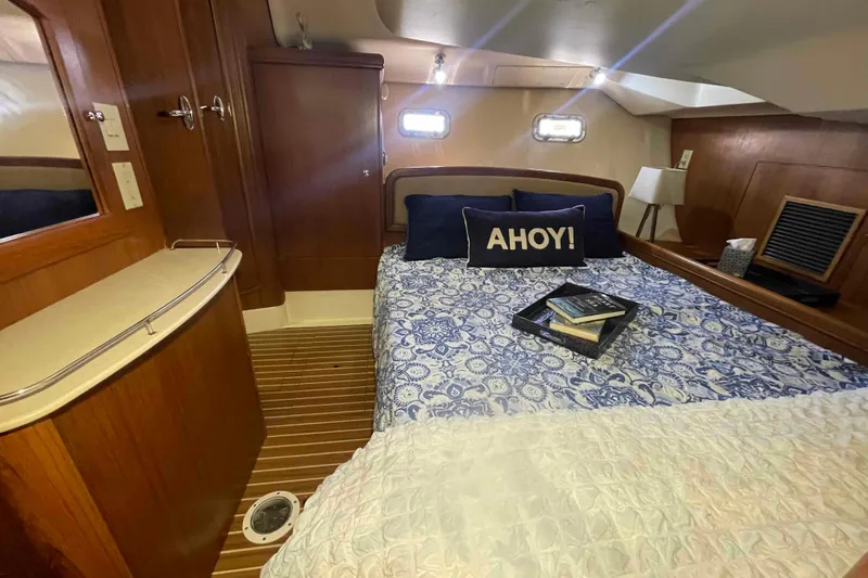 La Veda Yacht Photos Pics Cozy cabin interior of 2003 Hunter 426 Deck Salon with nautical decor.