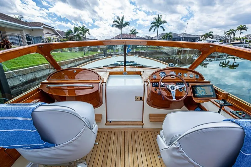 Mareca Yacht Photos Pics 2004 Hinckley Talaria 29 R boat interior with wooden dashboard and leather seats.