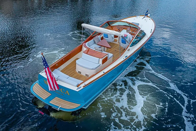 Mareca Yacht Photos Pics 2004 Hinckley Talaria 29 R boat cruising on water, featuring elegant design and American flag.