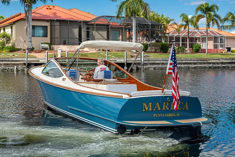 Mareca Yacht Photos Pics 2004 Hinckley Talaria 29 R boat cruising in a canal, Punta Gorda, Florida.