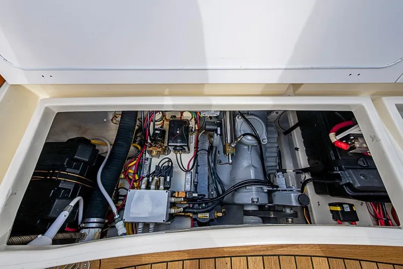 Mareca Yacht Photos Pics Engine compartment of a 2004 Hinckley Talaria 29 R, showcasing wiring and components.