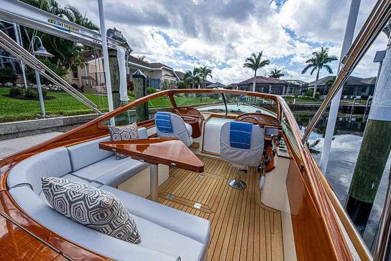 Mareca Yacht Photos Pics 2004 Hinckley Talaria 29 R boat interior with elegant wood finish and plush seating.