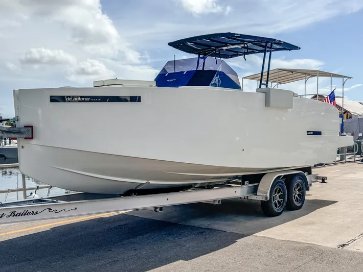  Yacht Photos Pics 2024 De Antonio Yachts D28 Open on trailer, dockside under clear sky.