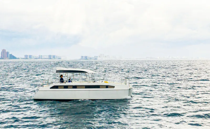  Yacht Photos Pics Electric catamaran Smart Cat E280 sailing on open water, 2025 model.