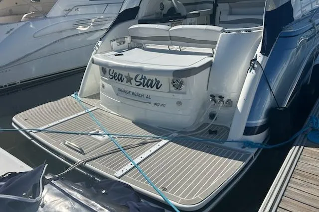 Sea Star Yacht Photos Pics 2018 Formula 40 Performance Cruiser docked, featuring spacious deck and seating area.