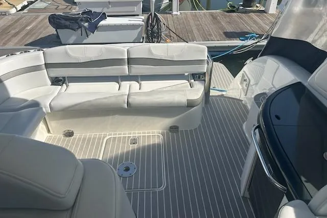 Sea Star Yacht Photos Pics 2018 Formula 40 Performance Cruiser interior with white seating and striped flooring.