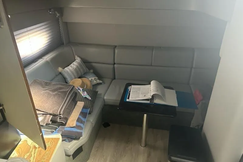 Sea Star Yacht Photos Pics 2018 Formula 40 Performance Cruiser interior with gray seating, table, and nautical decor.