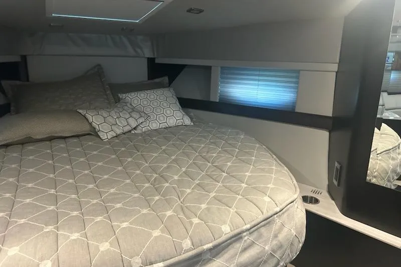 Sea Star Yacht Photos Pics Interior cabin of 2018 Formula 40 Performance Cruiser with cozy bed and pillows.