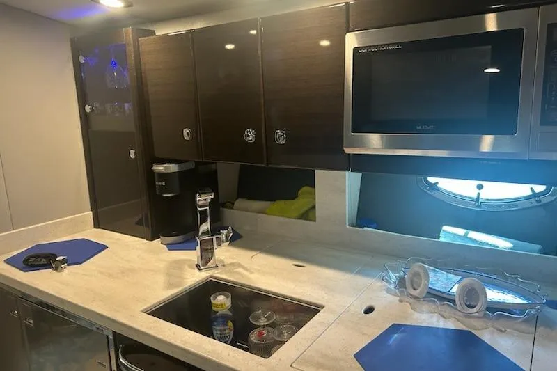 Sea Star Yacht Photos Pics 2018 Formula 40 Performance Cruiser kitchen with modern appliances and sleek cabinetry.