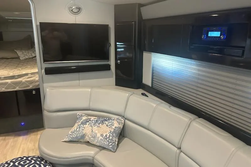 Sea Star Yacht Photos Pics 2018 Formula 40 Performance Cruiser interior with modern seating, TV, and cozy sleeping area.