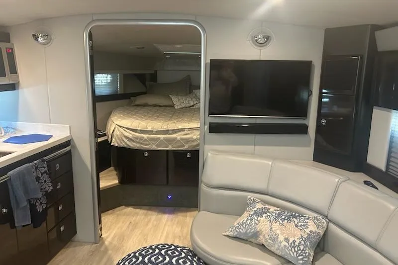 Sea Star Yacht Photos Pics 2018 Formula 40 Performance Cruiser interior with bed, TV, and seating area.