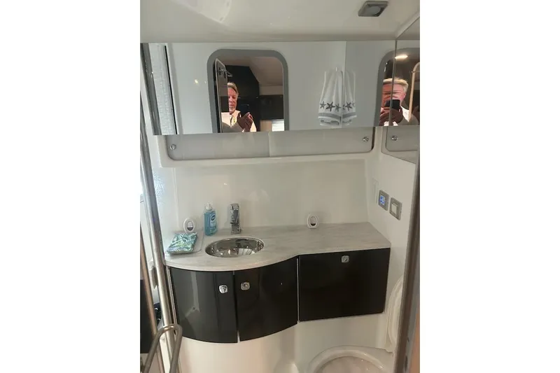 Sea Star Yacht Photos Pics 2018 Formula 40 Performance Cruiser bathroom with modern sink and mirrored cabinet.