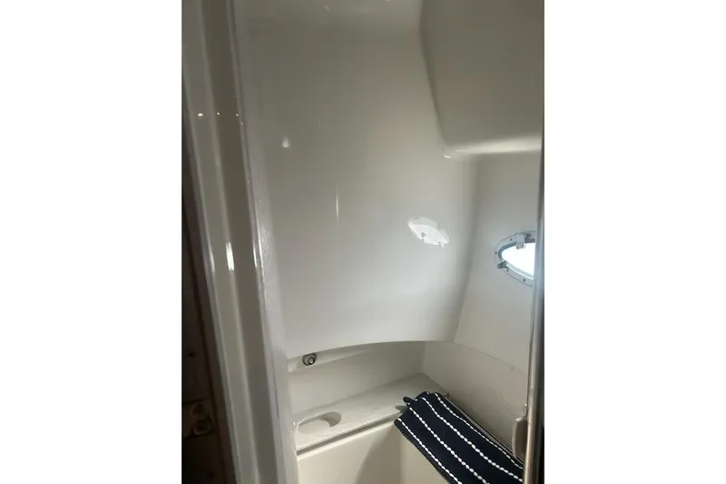 Sea Star Yacht Photos Pics Interior of 2018 Formula 40 Performance Cruiser bathroom with window and towel.
