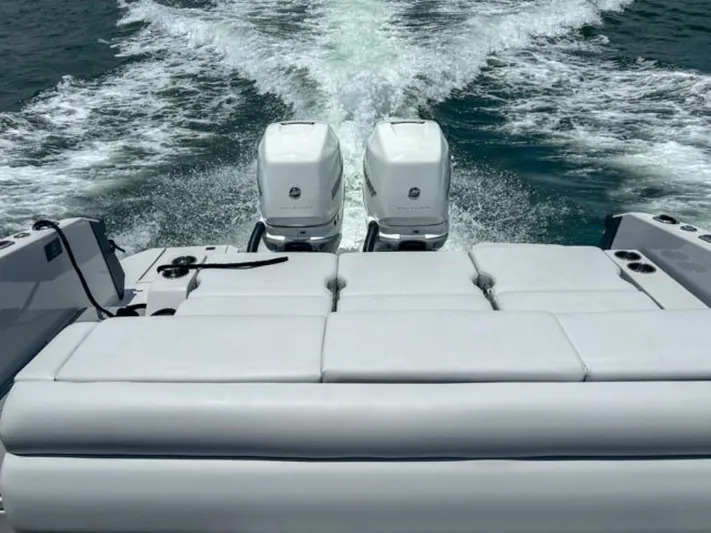  Yacht Photos Pics 2020 Aviara AV32 OB boat with twin outboard engines cruising on water.