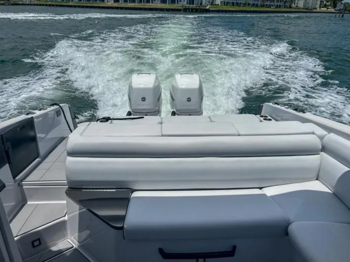  Yacht Photos Pics 2020 Aviara AV32 OB boat with twin outboard engines cruising on water.