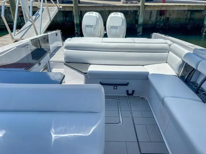  Yacht Photos Pics 2020 Aviara AV32 OB boat interior with white seating and twin outboard motors.