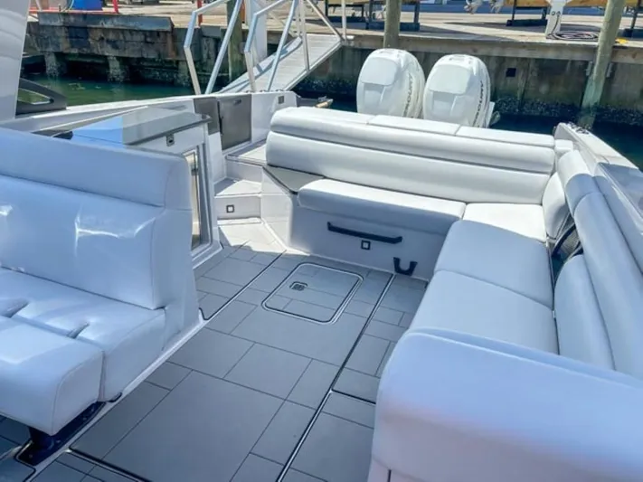  Yacht Photos Pics 2020 Aviara AV32 OB boat with spacious white leather seating and twin outboard engines.