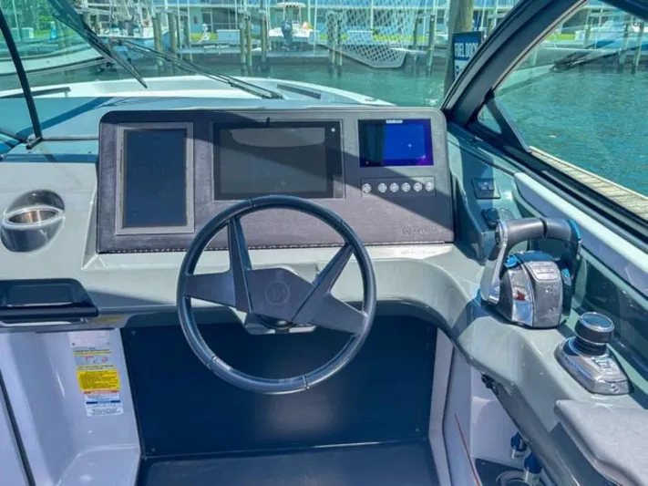  Yacht Photos Pics 2020 Aviara AV32 OB boat dashboard with steering wheel and control panel.