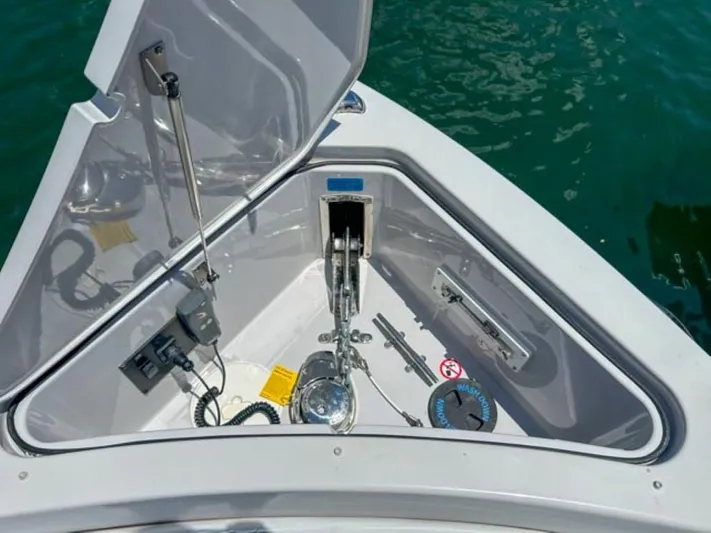  Yacht Photos Pics 2020 Aviara AV32 OB anchor compartment with open hatch, docked on water.