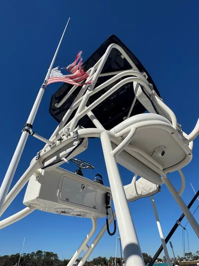 Tradition Yacht Photos Pics HCB 53 Sue&ntilde;os 2016 boat tower with flag, blue sky.