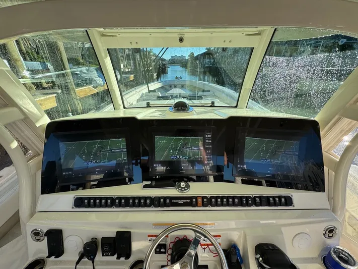 Tradition Yacht Photos Pics Interior view of 2016 HCB 53 Sueños with modern screens.