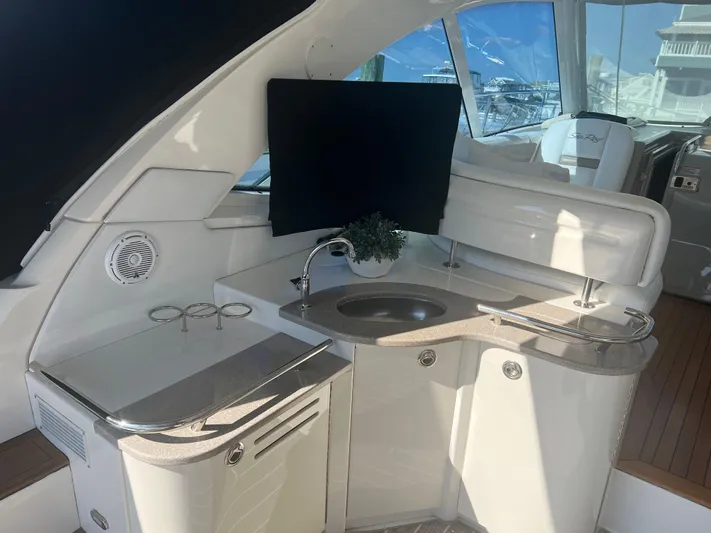  Yacht Photos Pics Interior of 2006 Sea Ray 48 Sundancer yacht with kitchenette and sink.