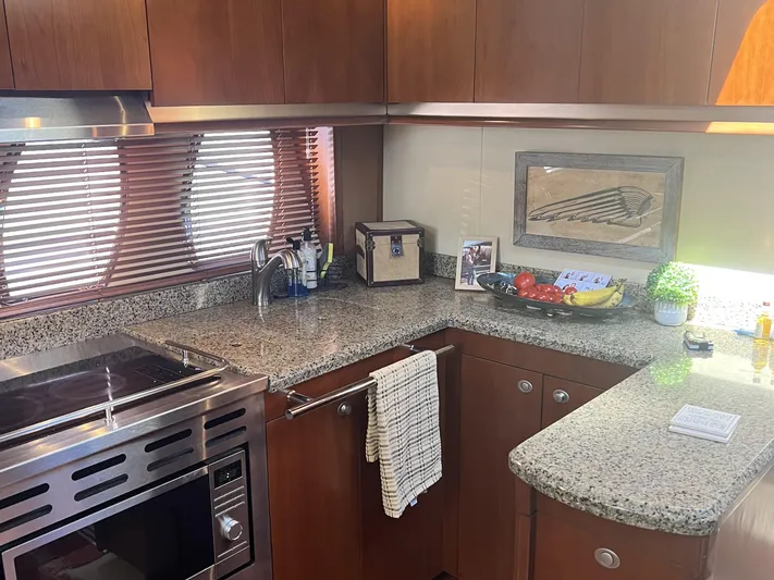  Yacht Photos Pics Luxurious kitchen interior of 2006 Sea Ray 48 Sundancer yacht with granite countertops.