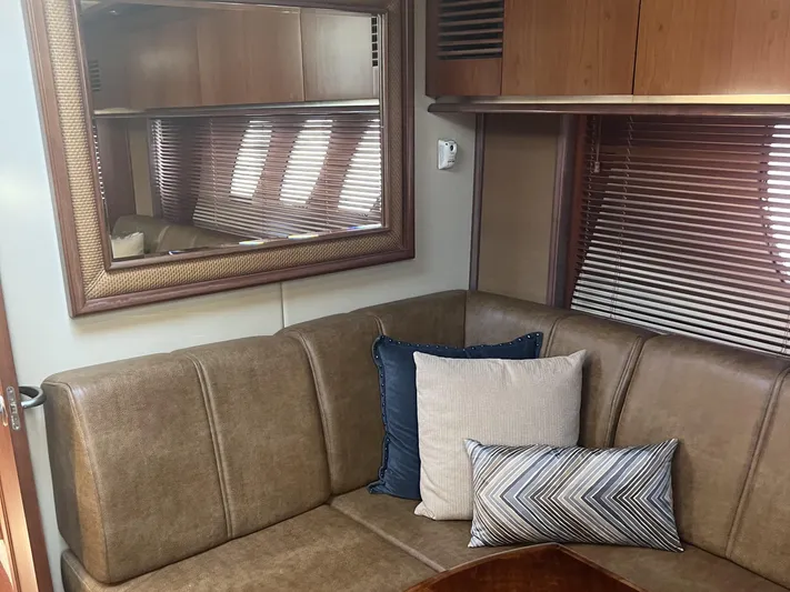  Yacht Photos Pics Luxurious interior of 2006 Sea Ray 48 Sundancer yacht with plush seating and decorative pillows.