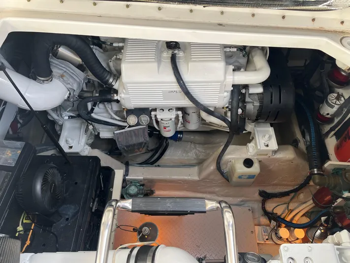  Yacht Photos Pics Engine compartment of a 2006 Sea Ray 48 Sundancer boat, showcasing mechanical components.