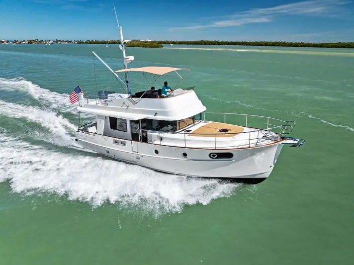 Lady Di Yacht Photos Pics 2012 Beneteau Swift Trawler 44 cruising on calm green waters under a clear blue sky.
